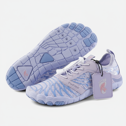 A pair of purple and blue running shoes with a textured sole and a tag attached to the side.