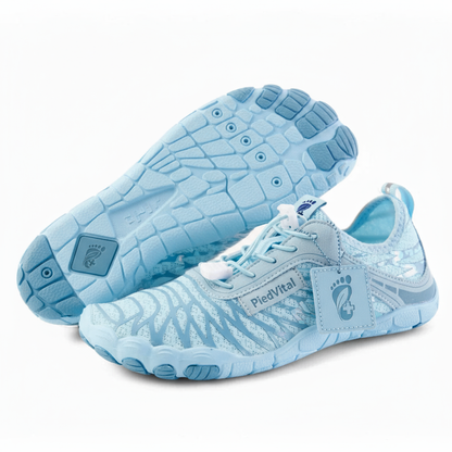 A pair of light blue and white running shoes with a distinctive zebra print pattern.
